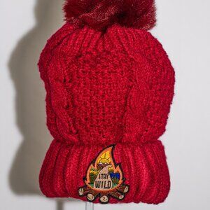 Red stocking cap with "Stay Wild" patch and fuzzy lining